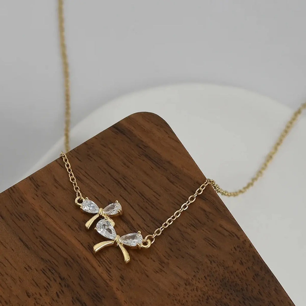 Colgante Bow Zircon